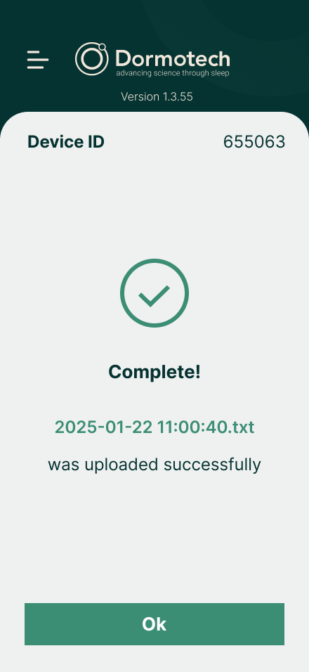 App screen confirming the test is complete and the file was uploaded successfully, with an Ok button